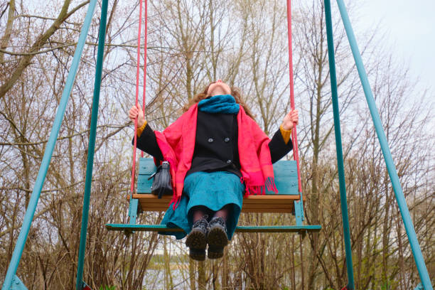 istock woman swinging on the swing 1316694791