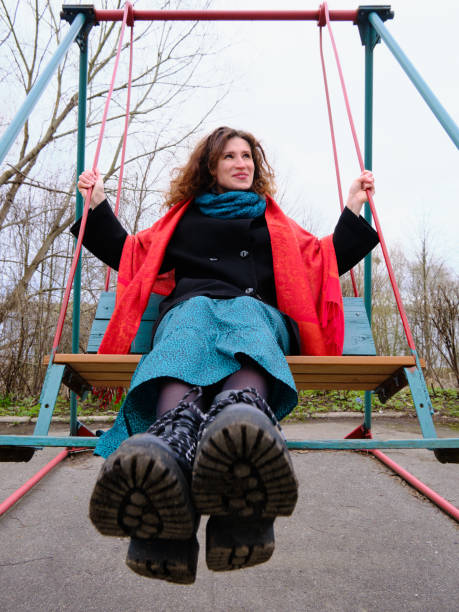 istock woman swinging on the swing 1316694793