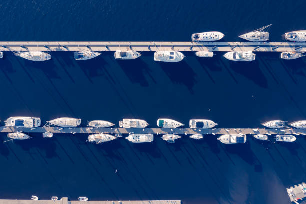 Aerial View of Marina with Boats at Dock Boats moored at the marina on the Amelia River near Jacksonville, Florida. fernandina beach stock pictures, royalty-free photos & images