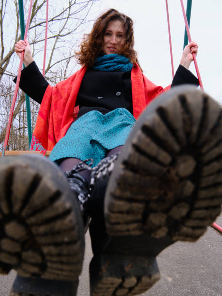 istock woman swinging on the swing 1316694923
