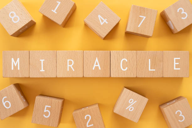 istock MIRACLE; Wooden blocks with 