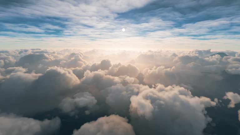 view of clouds over the mountains from above