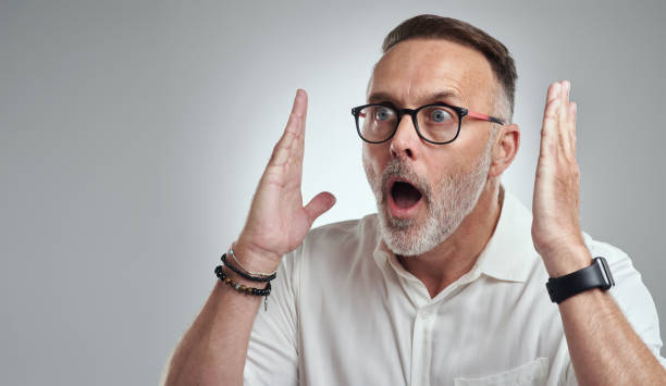 istock Studio shot of a mature man looking surprised against a grey background 1316702201