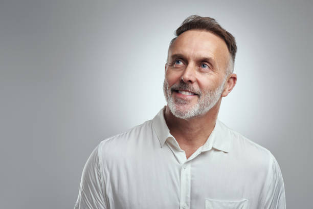 istock Studio shot of a mature man looking thoughtful against a grey background 1316702236