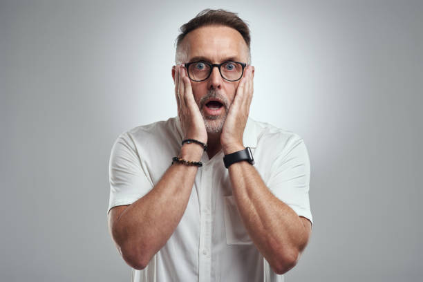istock Studio portrait of a mature man looking surprised against a grey background 1316702243