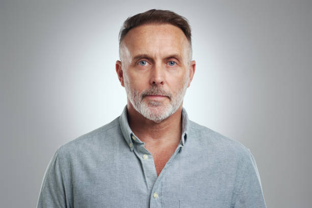 istock Studio portrait of a mature man standing against a grey background 1316702475