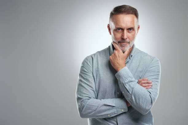 istock Studio portrait of a mature man looking thoughtful against a grey background 1316703143
