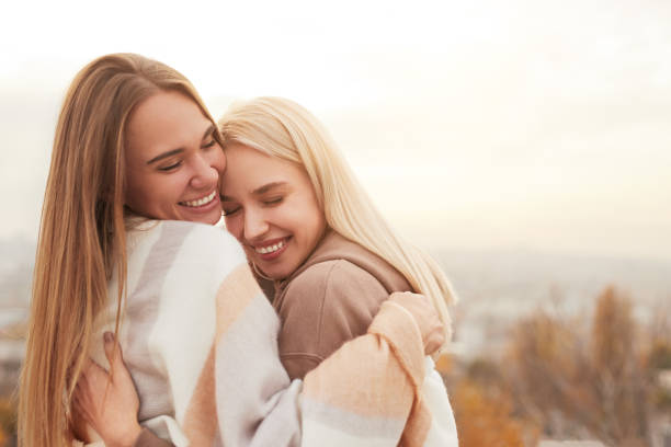 istock Happy lesbian couple hugging in countryside 1316709735