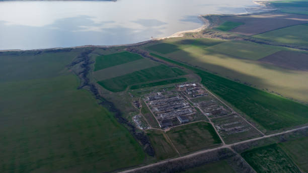 Odesa outskirts top view. View of the Krasnoselka village and the Kuyalnitsky estuary from a helicopter. Odesa outskirts top view. View of the Krasnoselka village and the Kuyalnitsky estuary from a helicopter odessa beach stock pictures, royalty-free photos & images