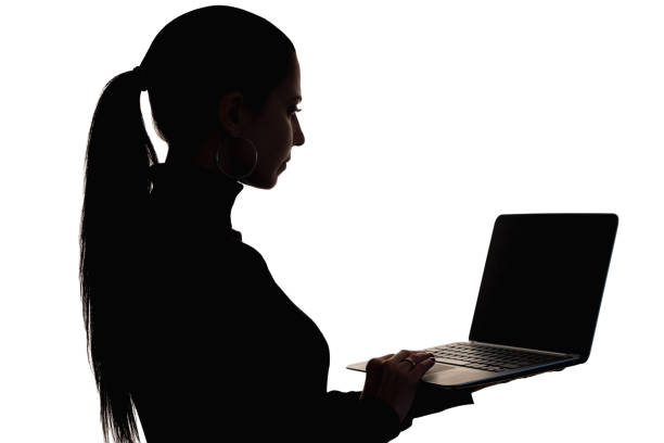 Online shopping. Silhouette portrait. Banking service. Digital technology. Dark shape business woman holding laptop in hand searching information isolated on white.
