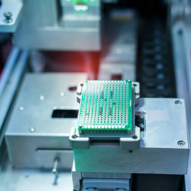 istock automatic robot for print circuit board (PCB)assembly machine during soldering or welding part 1316710084
