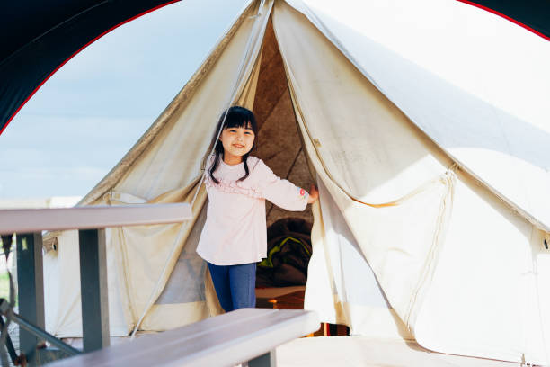 istock Little girl enjoying camping with smile 1316715232