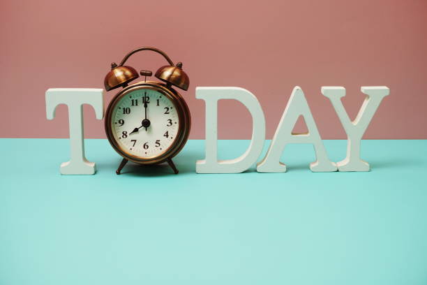 istock Today alphabet letter and alarm clock on blue and pink background 1316718722