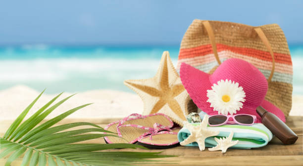 istock Sunhat, Flip-Flops and Seashells Against an Ocean Beach Background 1316719600