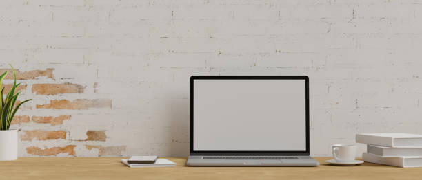 istock 3D rendering, laptop with mock-up screen on wooden table in office workspace 1316720401