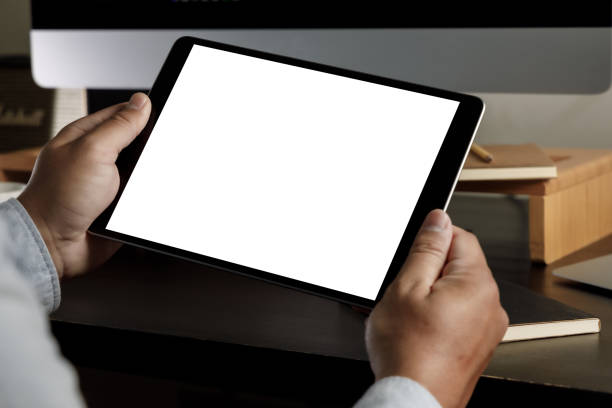 istock man holding blank screen tablet design  Close up of tablet computermock up tablet computer 1316723846
