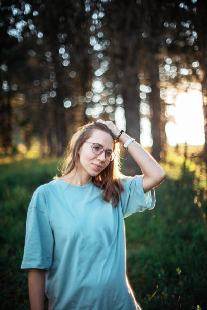 istock woman walking early in summer forest area 1316727893