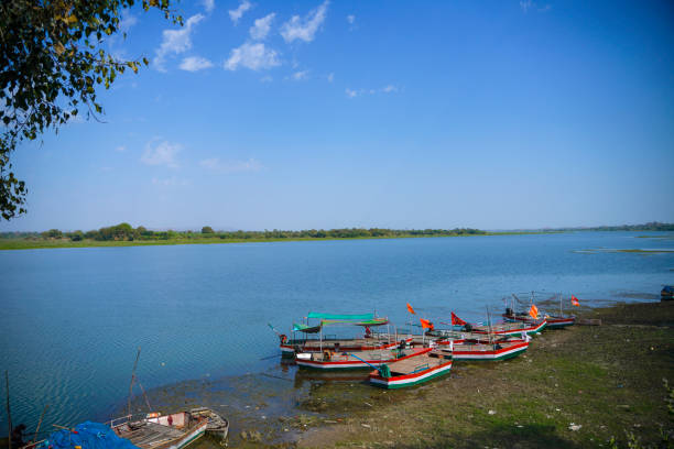 Paddle boats stand by for tourist in lake side