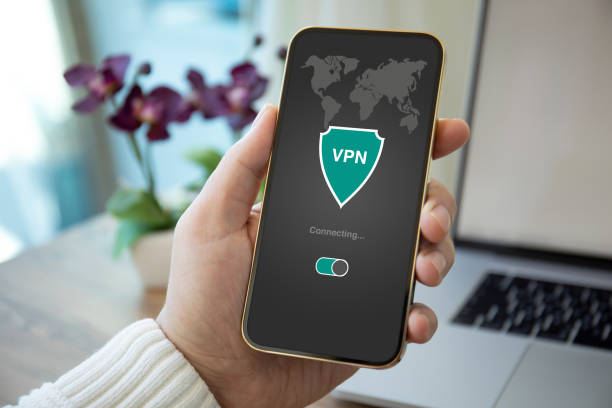 istock male hand holding phone with app vpn on the screen 1316729931