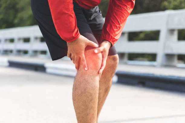 istock A runner has sore knees because he has been running for too long. Exercising until the injury. Training athlete work out at outdoor concept. 1316730168