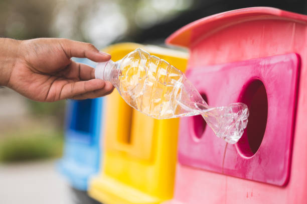 istock A young man drinks from plastic bottles and throws them into the trash. Video about environmental day Separate plastic waste in the correct category. Public trash 1316730203