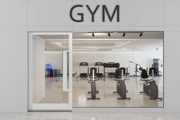 Facade Of Fitness Club Entrance With Treadmill, Fitness Ball And Other Exercise Equipments Facade Of Fitness Club Entrance With Treadmill, Fitness Ball And Other Exercise Equipments leisure facilities stock pictures, royalty-free photos & images