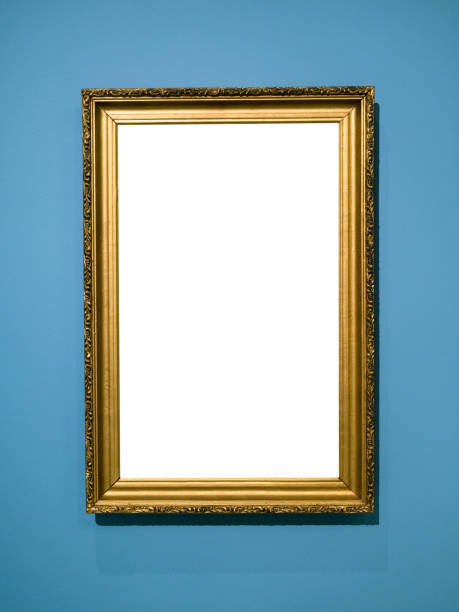 istock vertical golden wooden picture frame on blue wall 1316732752