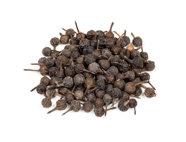 istock pile of dried cubeb pepper closeup on white 1316733059