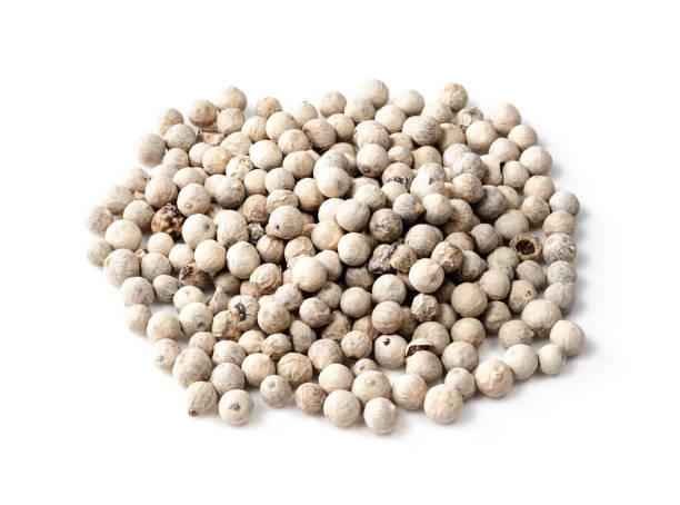 istock pile of white pepper peppercorns closeup on white 1316733163