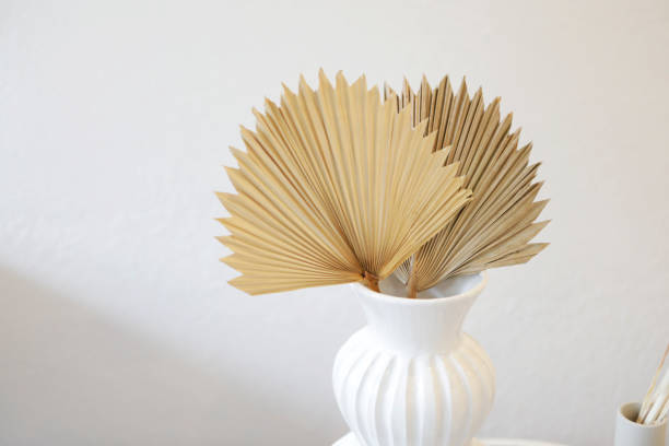 istock Palm tree leaves in white vase 1316736022
