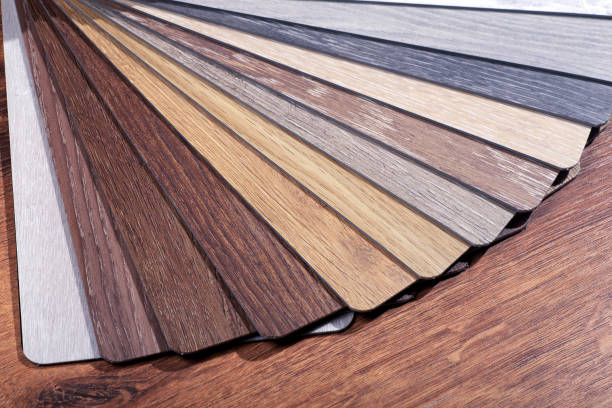 istock Vinyl and linoleum samples on a white isolated background. Vinyl for flooring with wood grain texture and pattern. 1316737085