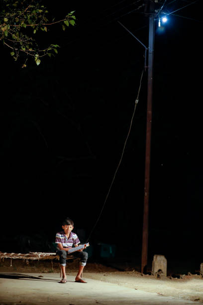 istock Poor child doing his homework at home 1316738106
