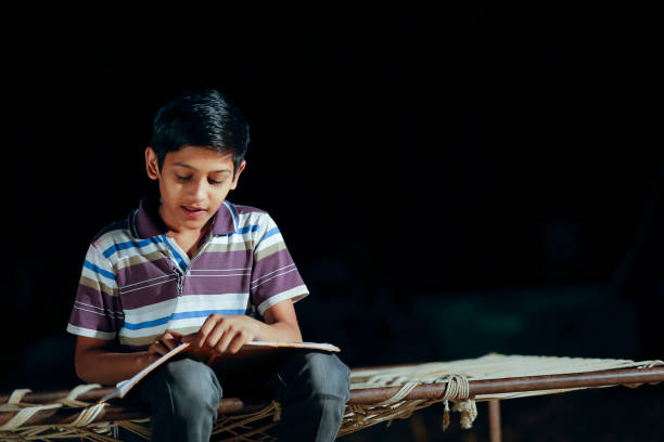 istock Poor child doing his homework at home 1316738118