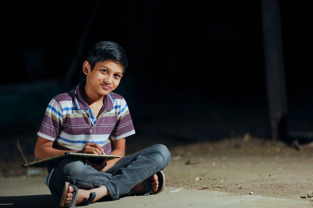 istock Poor child doing his homework at home 1316738131