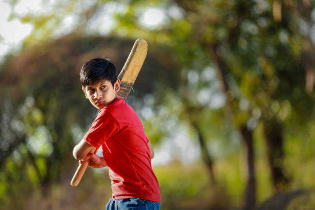 istock Rural Indian Child Playing Cricket 1316738173
