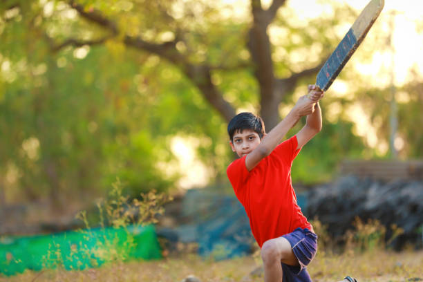 istock Rural Indian Child Playing Cricket 1316738199