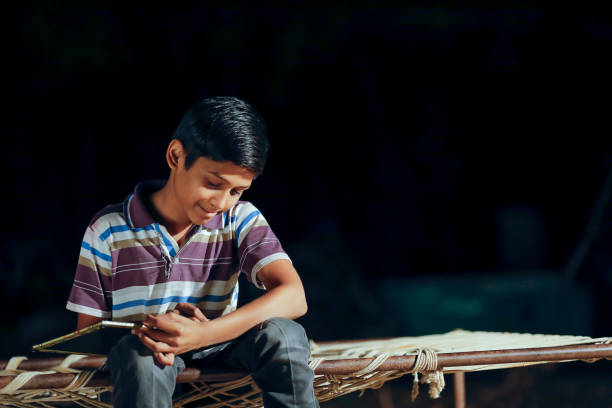 istock Poor child doing his homework at home 1316738212