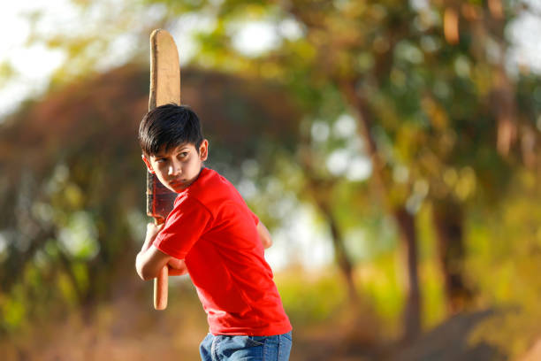 istock Rural Indian Child Playing Cricket 1316738227