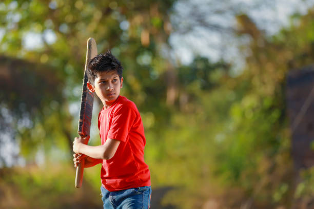 istock Rural Indian Child Playing Cricket 1316738278