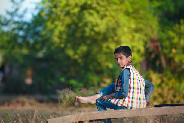Rural Indian Child Playing Cricket