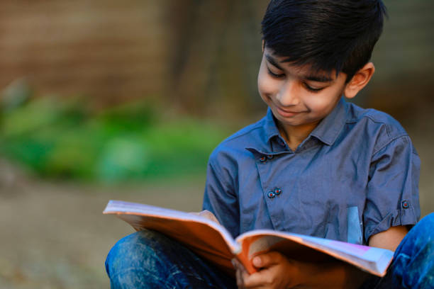 istock Cute indian child studying at home 1316738312