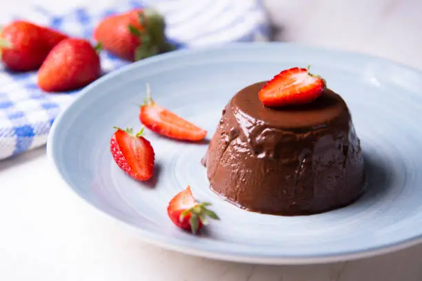 Chocolate pannacotta with strawberries.