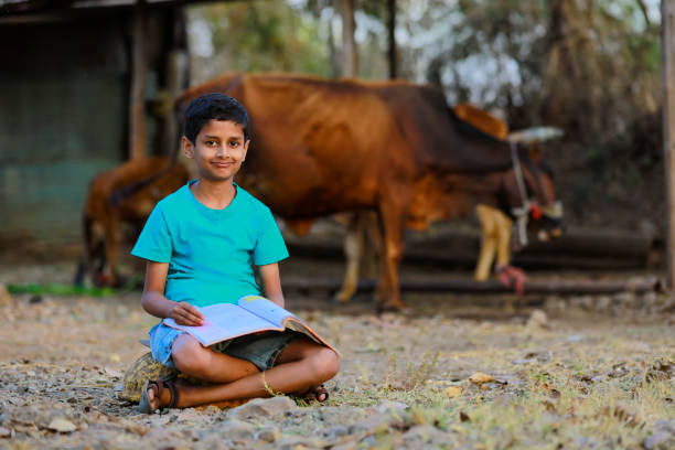 istock Cute indian child studying at home 1316738408
