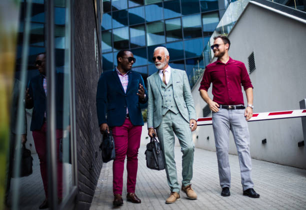 istock Three happy business men walking and talking outside. 1316738594