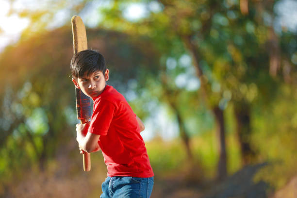 istock Rural Indian Child Playing Cricket 1316738614