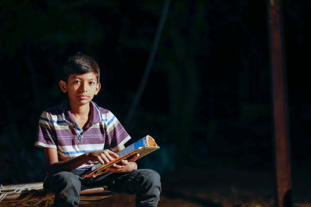 istock Poor child doing his homework at home 1316738643