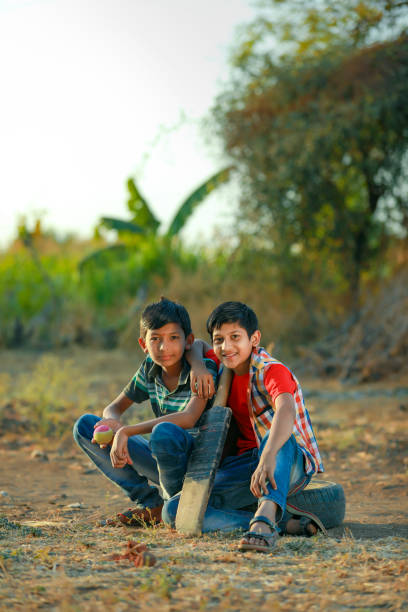 istock Rural Indian Child Playing Cricket 1316738652