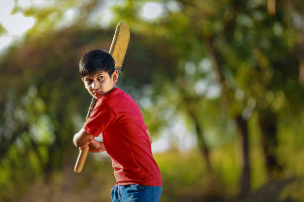 istock Rural Indian Child Playing Cricket 1316738678