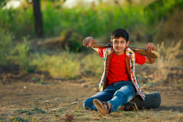 istock Rural Indian Child Playing Cricket 1316738679