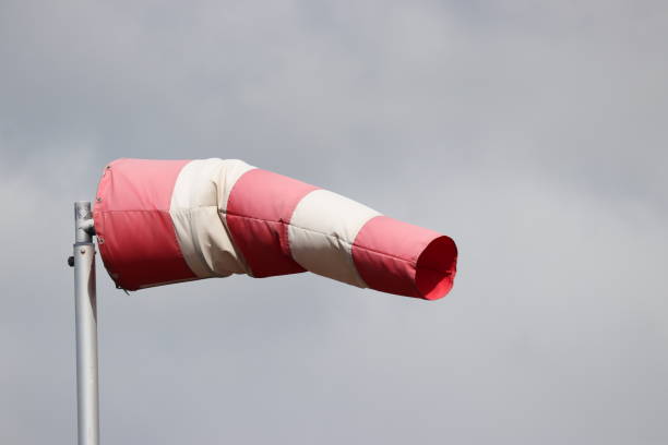 istock red and white windsock to indicate direction and strength of the wind 1316739125